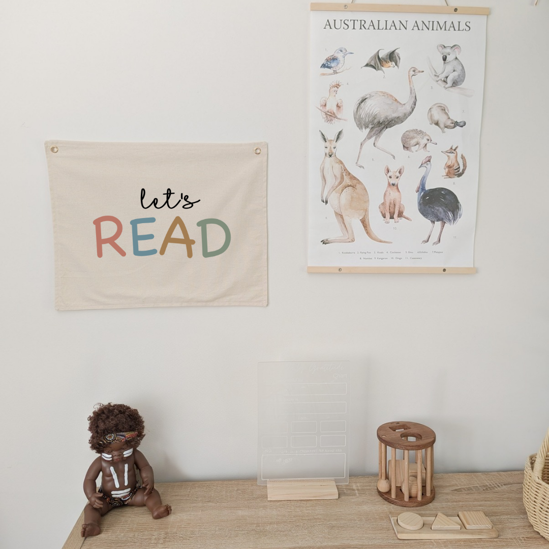 lets read wall banner for kids playroom or nursery in a neutral colour and pastels. kids who like to read decor .